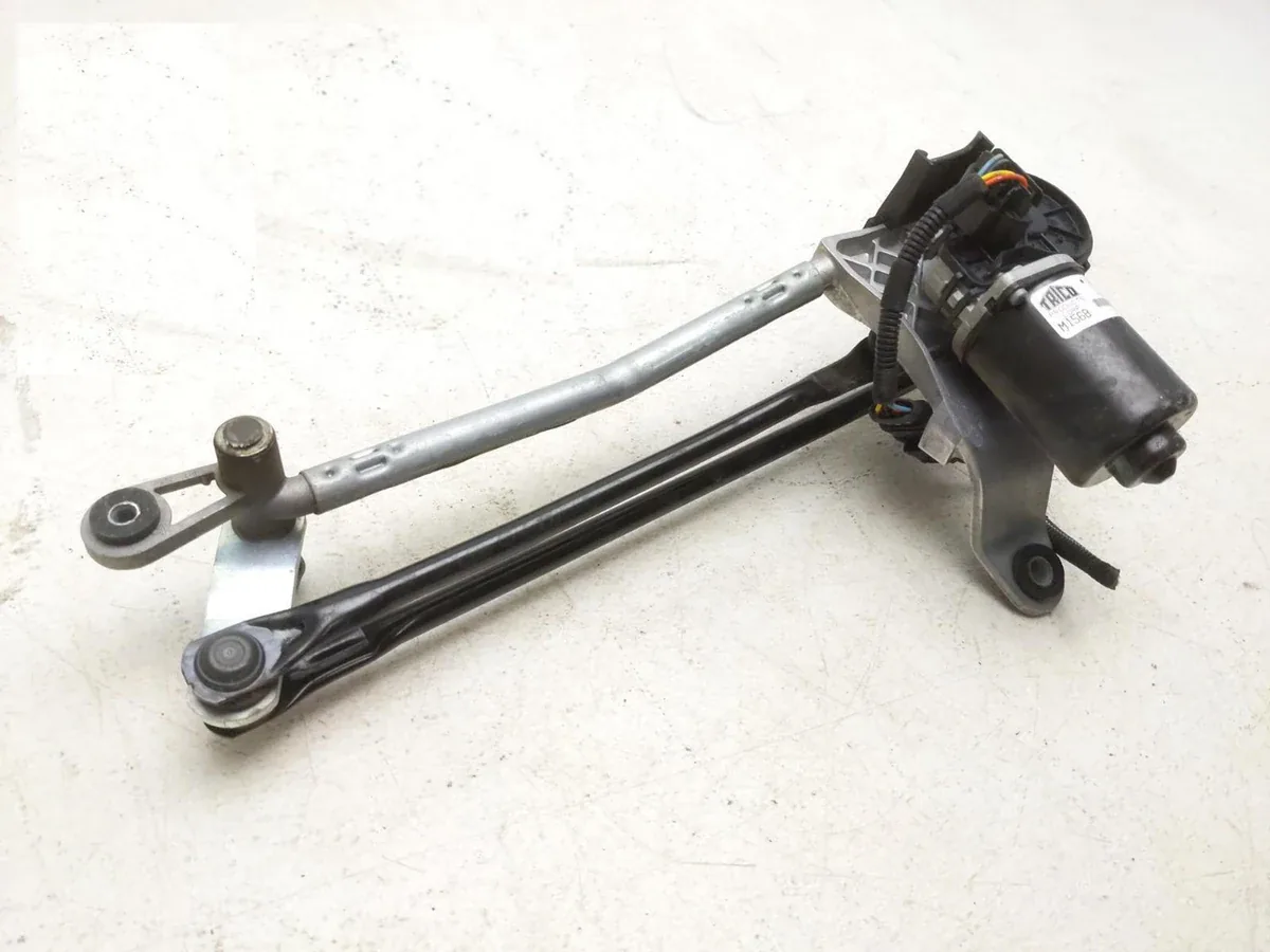 Maserati M156 wiper module photographed at an angle, showing the motor mounted across the module structure