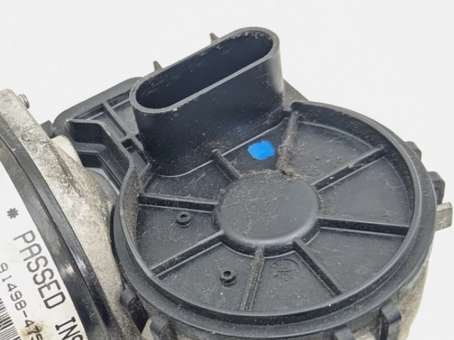 Close view of the Maserati M156 wiper motor and integrated electrical connector area