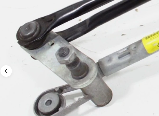 Close view of a Maserati M156 wiper pivot and cast support structure